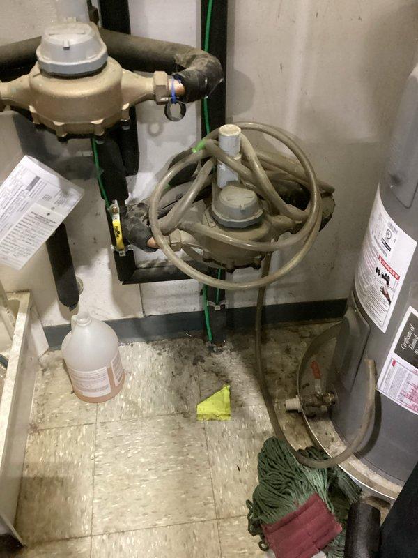 Responded to customer request for main water line leak location. Upon arrival, confirmed water supply had been shut off and standing water was present at the property. Conducted leak detection and diagnostic assessment of the main water line system. Inspected exterior foundation area where landscape fabric and soil disturbance indicated potential leak location near building perimeter. Examined interior mechanical room plumbing infrastructure, including water distribution system, pressure regulation equipment, and water heater connections. Documented conditions of affected areas showing moisture presence and plumbing component configuration. Identified leak source and provided recommendations for necessary repairs to restore water service.