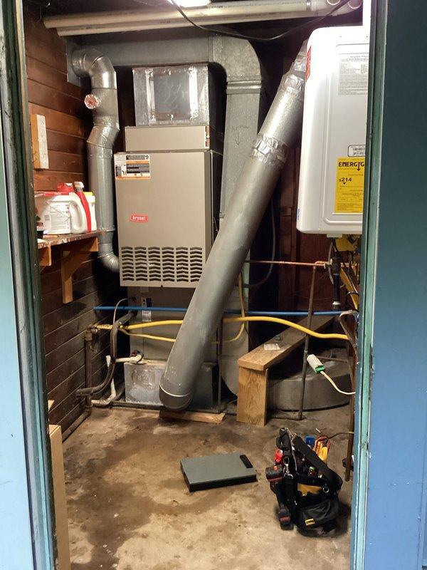 # HVAC Maintenance Service Completed

Performed planned furnace maintenance on a residential heating system approximately 10+ years old. Conducted comprehensive inspection of Bryant furnace unit located in interior utility closet, verifying operational status of all components including burner assembly, heat exchanger, and blower motor. Replaced air filter to manufacturer specifications to ensure proper airflow and system efficiency.

Inspected outdoor condensing unit positioned against building exterior, noting unit's age-appropriate condition with normal weathering. Verified refrigerant line connections and electrical conduit integrity. Cleared debris and vegetation from around condenser base to maintain adequate airflow clearance. Documented system configuration including refrigerant line routing and electrical connections.

All equipment operating within normal parameters upon completion of maintenance procedures.