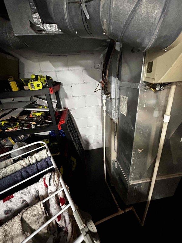 Completed estimate for residential HVAC system replacement, evaluating conversion from conventional air conditioning to geothermal heating and cooling system. Assessed existing furnace installation, ductwork configuration, and electrical panel capacity to determine feasibility and requirements for geothermal heat pump installation. Documented current mechanical room layout and utility connections for system design specifications.