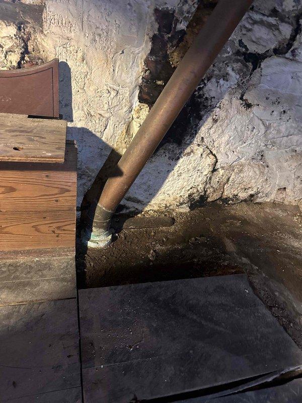 Responded to clogged basement sink with sewer odor. Accessed drain line in crawl space and inspected plumbing infrastructure. Cleared blockage from sink drain line using appropriate drain cleaning equipment. Verified proper drainage and flow restoration. Inspected surrounding copper piping for corrosion and potential issues that could affect drainage system. Confirmed single fixture issue with no backup into other drains or fixtures. Tested drain flow and verified elimination of sewer smell upon completion.