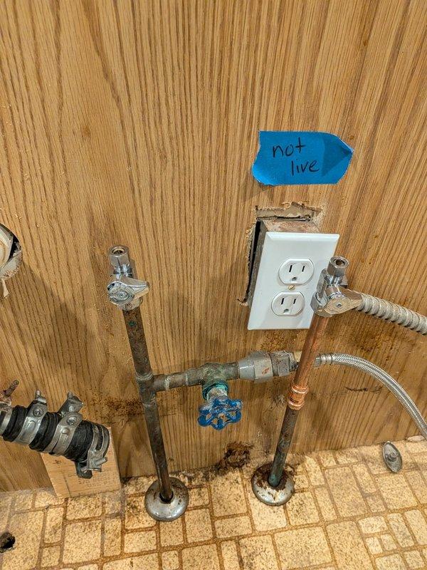 Responded to service call for broken cold water shut-off valve with minimal leaking. Upon arrival, inspected plumbing system in basement utility area and confirmed the shut-off valve lever had broken off, rendering the valve inoperable. Assessed the copper piping configuration, water filtration system tanks, and associated plumbing connections for any additional damage or concerns. Replaced the defective shut-off valve with new chrome-plated quarter-turn shut-off valve, ensuring proper connection to existing copper supply lines. Tested the new valve for proper operation and verified no active leaks were present. Confirmed water supply was restored and shut-off functionality was operational for future use.