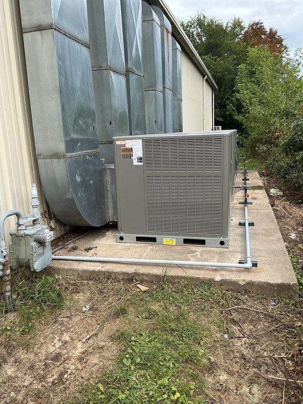 Completed installation of three-unit HVAC system including final duct transitions to units 2 and 3, and gas line connections to all three units. All equipment mounted on appropriate platforms with proper condensate drainage, ventilation clearances verified, and system ready for startup and commissioning.