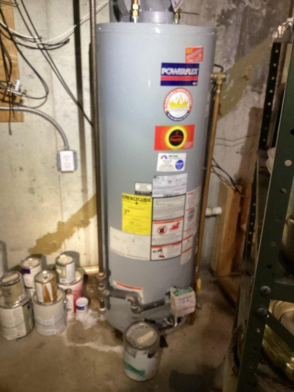 Responded to no cooling complaint on 10-year-old basement HVAC system with airflow present but no cooling output. Performed diagnostic inspection of air conditioning system, checked electrical connections, refrigerant levels, and compressor operation to identify cause of cooling failure. Additionally documented water heater leak in utility room during service visit.