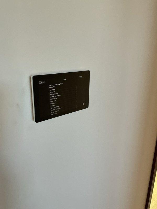 Completed full HVAC system installation in basement utility area, including EL297 furnace and EL18 air conditioning unit with new refrigerant line set. Installed S40 smart thermostat with touchscreen interface and integrated 1620 whole-home air cleaner into the system. All equipment mounted on raised platform, PVC condensate drainage lines properly routed, and flexible ductwork connections secured to ensure optimal airflow and system performance.