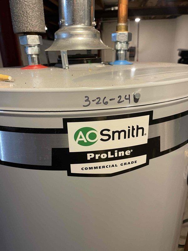 Replaced defective gas valve on AO Smith ProLine Commercial Grade tanked water heater under warranty coverage. Removed failed gas valve assembly, installed new OEM replacement component, and reconnected yellow flexible gas supply line. Verified all pipe connections secure, tested gas valve operation for proper functionality, and confirmed water heater returned to normal operating condition with no leaks detected.