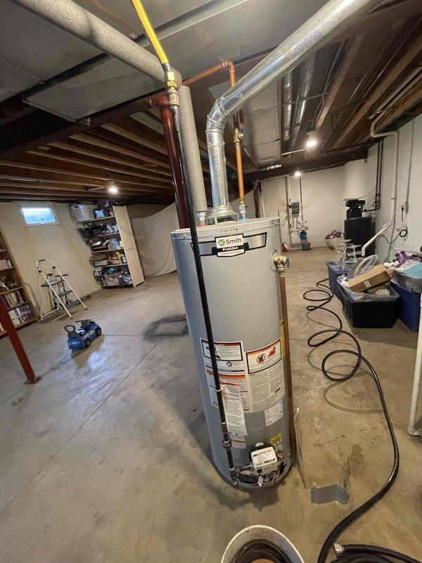 Replaced defective gas valve on AO Smith ProLine Commercial Grade tanked water heater under warranty coverage. Removed failed gas valve assembly, installed new OEM replacement component, and reconnected yellow flexible gas supply line. Verified all pipe connections secure, tested gas valve operation for proper functionality, and confirmed water heater returned to normal operating condition with no leaks detected.