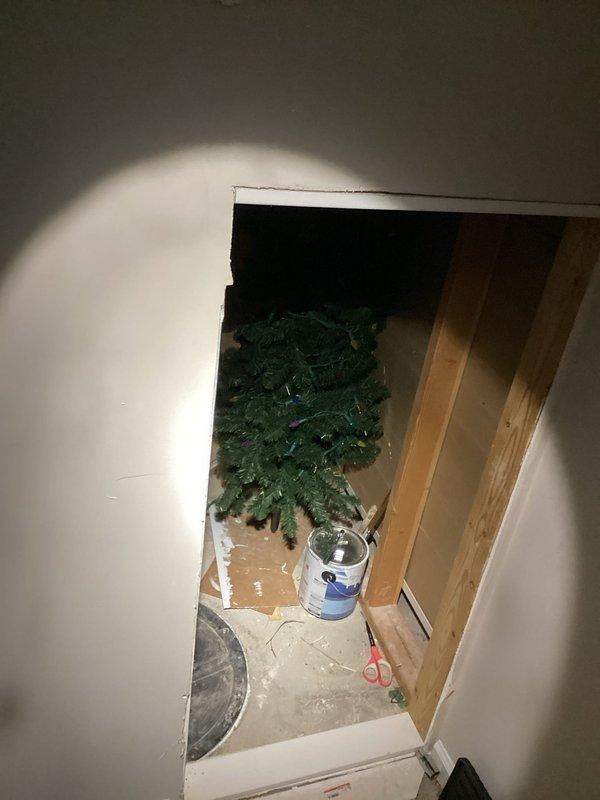 Responded to service call for non-operational sewage pump serving basement bathroom. Upon arrival, accessed pump location in under-stair utility space and confirmed pump failure with no power to unit despite no tripped breakers. Inspected dual-pipe sewage ejector system with floor-mounted rubber boot assembly and determined pump required replacement to restore functionality to basement plumbing fixtures.