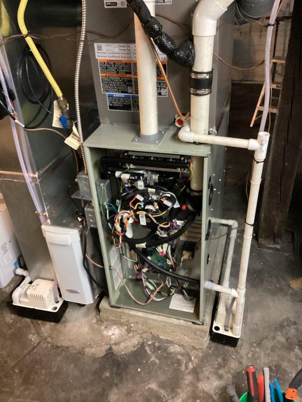 Responded to customer request for heating issue at office location. Upon inspection, determined heat exchanger on American Standard furnace required replacement. Ordered manufacturer-specified OEM replacement heat exchanger to maintain warranty compliance. Advised customer of 2-3 week lead time for part procurement due to factory-direct manufacturing and shipping requirements. Accessed air handler unit, documented existing system configuration and internal component condition. Unit interior showed reflective insulation in good condition with no visible deterioration. Photographed electrical wiring, blower motor assembly, and control components for reference during reassembly. Verified all warning labels and safety notices remain legible and intact on equipment housing.