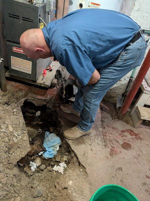 Installed a new A. O. Smith gas tank-style water heater per the approved quote, connecting copper and PEX water supply lines, the flexible gas line, and the flue to the existing venting. Performed concrete excavation in the basement floor to address the work area, then verified connections and system operation.