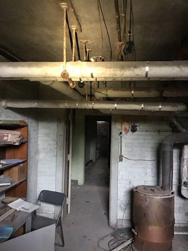 Performed an in-home evaluation for a non-operational heating system and assessed the existing boiler and distribution piping in the basement mechanical room. Documented heavy corrosion on the boiler top and upper tanks, along with aged, deteriorated pipe insulation and rusted hangers, and reviewed boiler replacement options and financing with the homeowner.