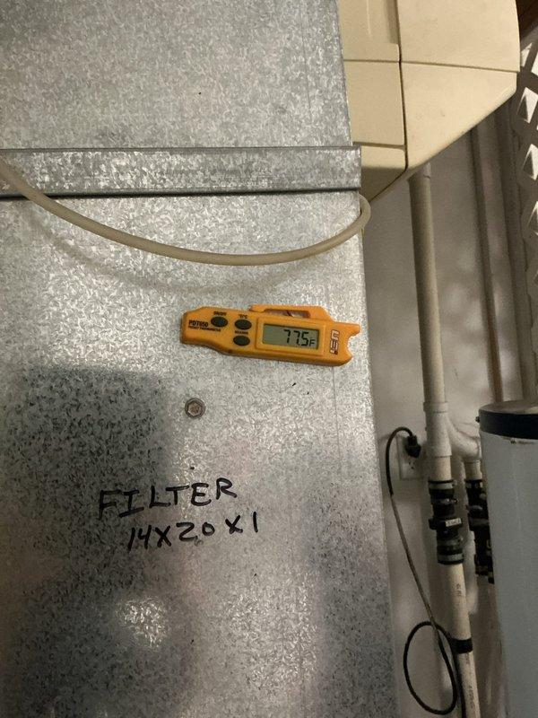 Installed a new Lennox ML180UH070E36A upflow gas furnace in the utility closet, connecting the gas supply with flexible gas line to black iron piping, the flue venting, and the PVC condensate drain. Mounted the 14x20x1 filter in the return duct with airflow direction and filter size labeled on the ductwork, and verified temperature readings at the unit with a handheld digital thermometer. Installation complete with all connections secured and no visible damage or leaks.
