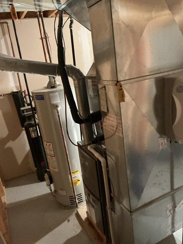 Installed a new Lennox ML180UH070XE36B upflow gas furnace, connected to the existing supply and return ductwork, gas line, PVC venting, and condensate drain, and sealed transitions with foil tape. Installed an Aprilaire 620 whole-home humidifier on the supply plenum and reused the existing thermostat. Completed startup and operational checks to verify proper furnace function.