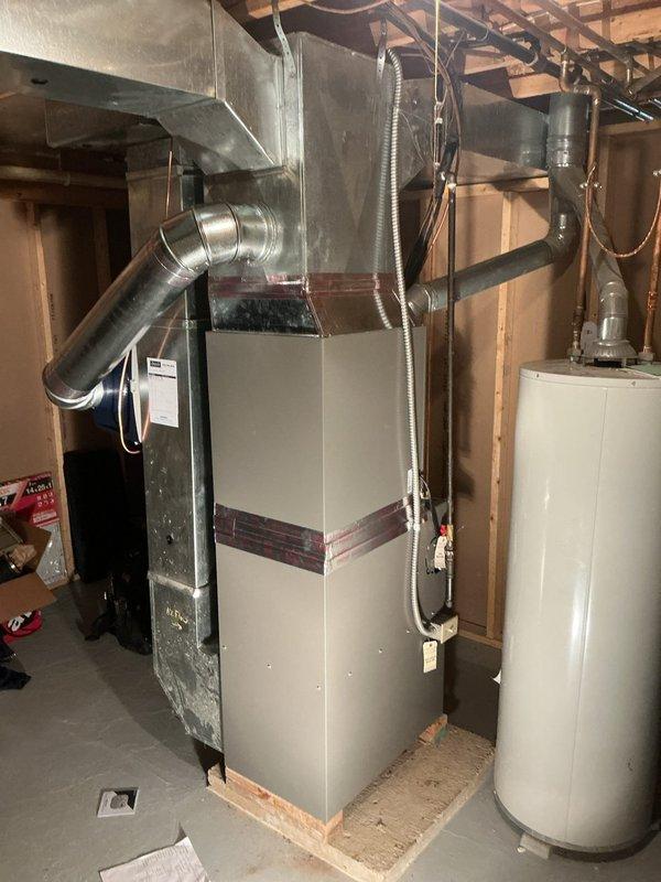 Installed a new Lennox ML180UH070XE36B upflow gas furnace, connected to the existing supply and return ductwork, gas line, PVC venting, and condensate drain, and sealed transitions with foil tape. Installed an Aprilaire 620 whole-home humidifier on the supply plenum and reused the existing thermostat. Completed startup and operational checks to verify proper furnace function.