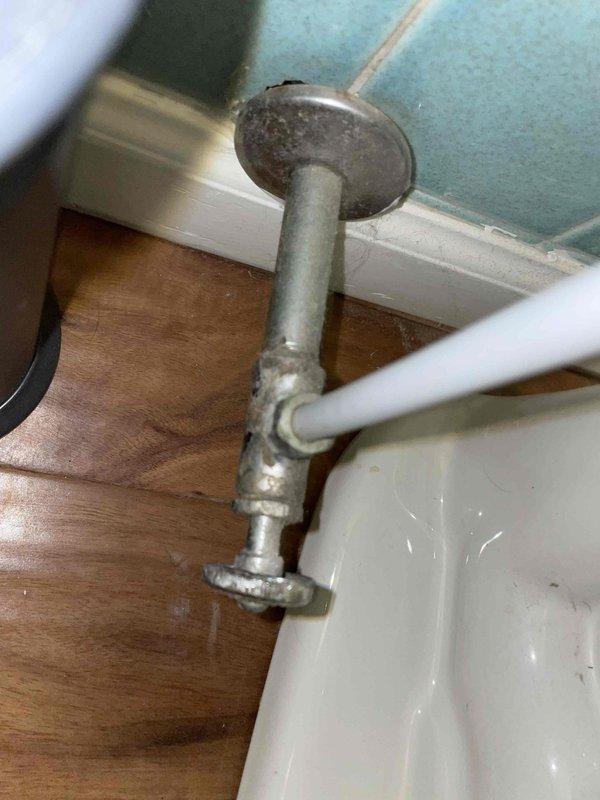 Removed and replaced the existing two-piece toilet, including installation of a new wax ring seal, closet bolts, and a new water supply line. Inspected the angle stop and found it heavily corroded with mineral buildup; recommended replacement to ensure reliable shutoff and prevent future leaks. Verified proper seating, secure anchoring, and leak-free operation after reconnecting the supply and flushing.