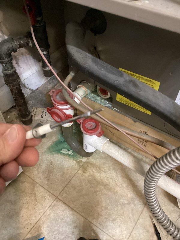 Performed planned heating maintenance on the gas furnace, including inspection and cleaning of the hot surface igniter and ignition components, and replaced the 14x20x1 air filter. Inspected the condensate drain assembly and PVC piping, noting green residue and mineral buildup at the drain connections, and recommended monitoring for leaks. Observed corrosion on the black iron gas piping and dust accumulation on the cabinet, and advised further evaluation of the piping.