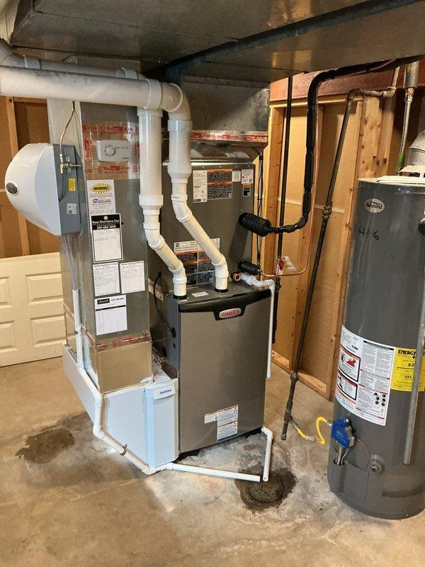 Completed full HVAC system replacement, installing a Lennox EL297UH090XV48C 90,000 BTU high-efficiency gas furnace with CK40CT-48C-71 evaporator coil, ML17KC2-036-230 3-ton condenser, and new 3/8" x 3/4" refrigerant lineset. Added an AA600M humidifier, AA1620 air cleaner, and S200 smart thermostat, then connected and routed PVC venting and condensate drain to the floor drain. Charged the R410A system by weight using a digital refrigerant scale and verified system operation.
