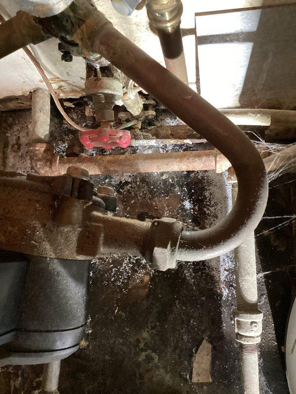 Completed a first-visit planned maintenance on a 1-year-old furnace, performing a full heating system diagnostic that covered safety inspection and electrical, motor, ignition, and gas system evaluations. Measured voltage, motor amp draws, flame sensor signal, igniter resistance, gas pressure, and temperature rise, with all readings within acceptable operating ranges and the system found operating properly. Noted heavy rust, corrosion, and debris buildup on the adjacent boiler piping and valve assembly, which may warrant further evaluation.