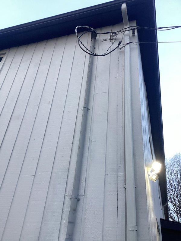 Completed 200 AMP service panel upgrade as specified. Installed new electrical service conduit on exterior wall with proper securing. Grounding work performed with minimal disturbance to surrounding landscape.