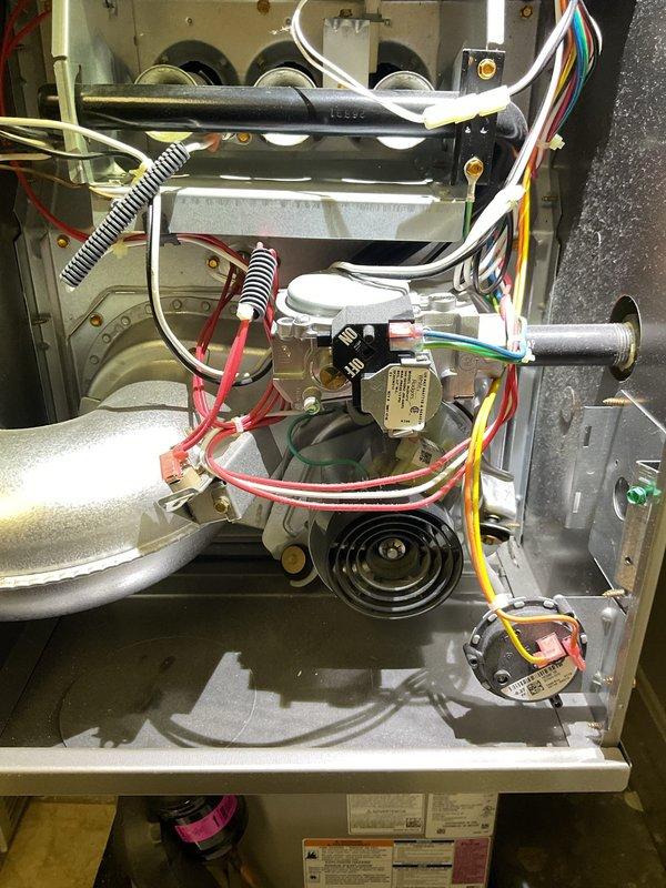 Performed comprehensive maintenance on an aging furnace (10+ years old) that had not been serviced in 3+ years. Inspected combustion chamber and observed proper blue flame pattern, indicating good combustion. Examined all electrical connections, control board functionality, and verified proper operation of blower assembly. System is currently operational but recommended continued annual maintenance due to the unit's age.