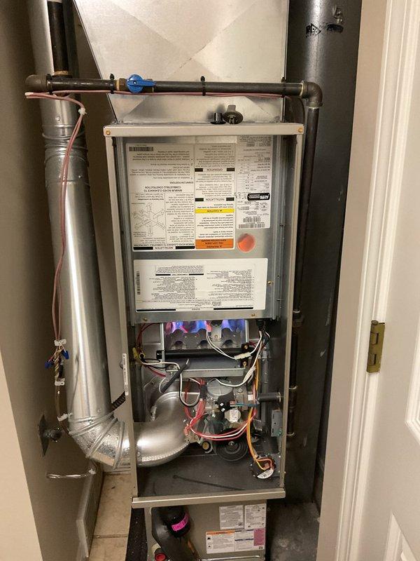 Performed comprehensive maintenance on an aging furnace (10+ years old) that had not been serviced in 3+ years. Inspected combustion chamber and observed proper blue flame pattern, indicating good combustion. Examined all electrical connections, control board functionality, and verified proper operation of blower assembly. System is currently operational but recommended continued annual maintenance due to the unit's age.