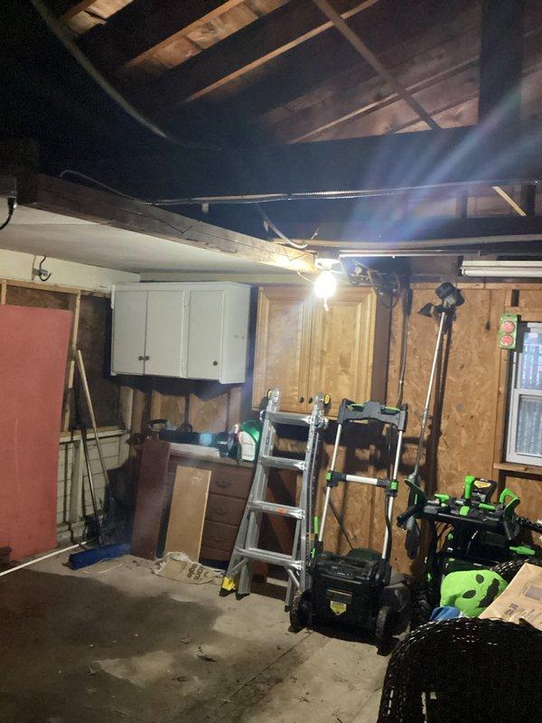 Responded to customer complaint of non-functional garage light fixture. Upon inspection, accessed ceiling area using ladder and identified loose connection in junction box. Secured wiring connections and verified proper operation of fixture. Confirmed all electrical components were safely installed according to code requirements.
