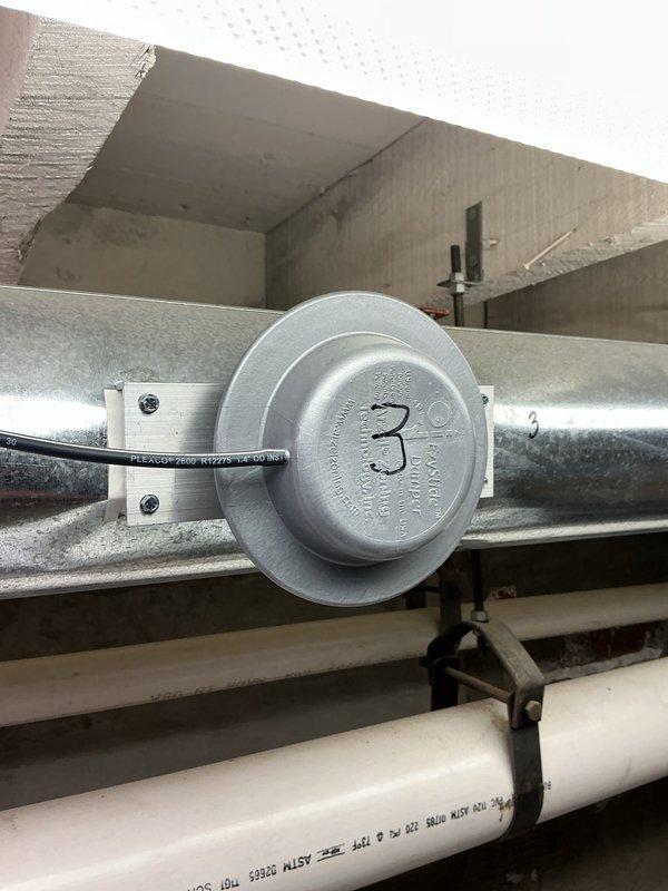Performed routine furnace maintenance service including inspection of control board wiring connections and temperature sensor (marked as "3") on ductwork. System was accessed with panels open to verify proper operation of all components.