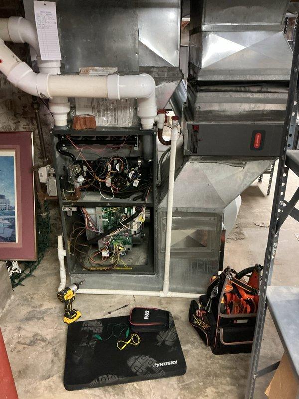 Performed routine furnace maintenance service including inspection of control board wiring connections and temperature sensor (marked as "3") on ductwork. System was accessed with panels open to verify proper operation of all components.