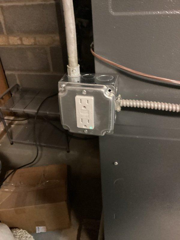 Assessed customer request for new outlet installation to power furnace humidifier. Inspected existing electrical infrastructure including ceiling-mounted security lighting and GFCI receptacle in weatherproof junction box. Evaluated optimal placement for new outlet and documented requirements for proper installation according to code.