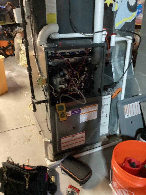 Conducted routine heating maintenance on residential furnace system. Performed electrical diagnostics with clamp meter confirming 0.35A draw and 40.8V, and verified proper heat exchanger temperature (348°F). All components inspected and system operating within manufacturer specifications.