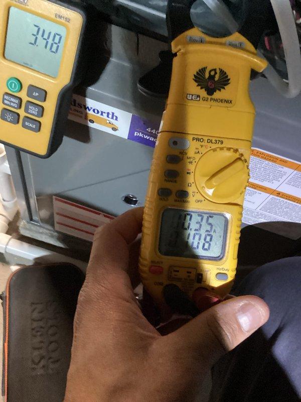Conducted routine heating maintenance on residential furnace system. Performed electrical diagnostics with clamp meter confirming 0.35A draw and 40.8V, and verified proper heat exchanger temperature (348°F). All components inspected and system operating within manufacturer specifications.
