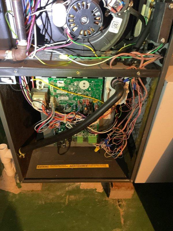 Performed comprehensive heating maintenance service on a forced air furnace system. Inspected and cleaned blower motor assembly, verified electrical connections, and examined control board functionality. All components found to be in good working condition with proper operation confirmed.