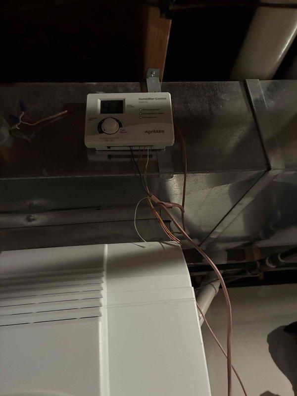 Completed warranty service call to install missing transformer and Aprilaire humidistat on existing HVAC system. Successfully wired and mounted the humidifier control unit to the ductwork, connecting all necessary electrical components with proper color-coded wiring to ensure proper functionality of the humidity control system.
