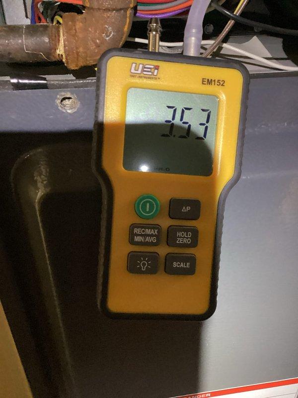 Performed monthly heating system maintenance inspection with thorough cleaning of dust-laden components. Conducted pressure testing using UEi EM152 manometer, recording steady system pressure at 35.7 WC. All heating components functioning within manufacturer specifications following service.