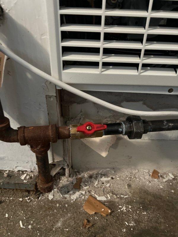 Successfully replaced garage heater unit with new system. Installed Honeywell Home digital thermostat with cooling functionality. Connected copper pipe assembly with shut-off valve to complete the installation.