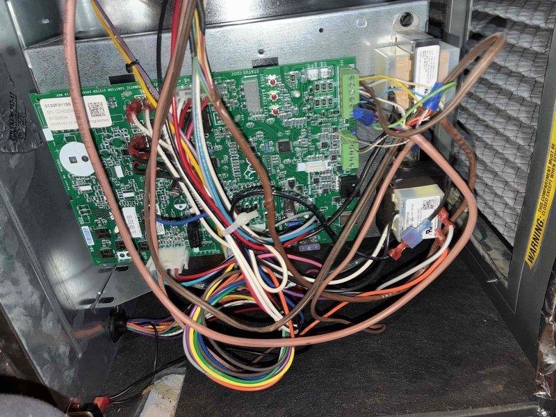 Performed comprehensive maintenance on customer's aging furnace system (10+ years old). Inspected circuit board and wiring connections, finding all components properly installed and functioning. Conducted combustion efficiency test using Testo 310 analyzer, which measured 98.4°F temperature and 5.2% readings, indicating acceptable operation for the unit's age.