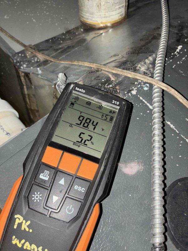 Performed comprehensive maintenance on customer's aging furnace system (10+ years old). Inspected circuit board and wiring connections, finding all components properly installed and functioning. Conducted combustion efficiency test using Testo 310 analyzer, which measured 98.4°F temperature and 5.2% readings, indicating acceptable operation for the unit's age.
