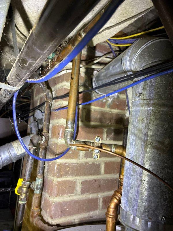 Conducted inspection of existing HVAC system for Mike Marcinick. Evaluated aging ductwork with visible wear in finished living space with wooden paneled walls and separate utility area. Observed copper plumbing lines running alongside galvanized ductwork in basement mechanical room. Documented current system condition and presented multiple replacement options for both furnace and ductwork to address identified repair issues.