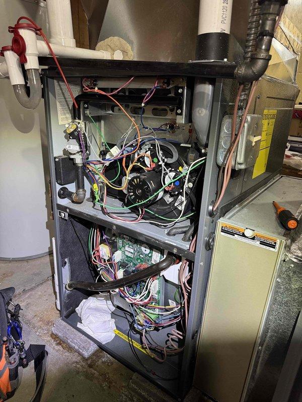 Performed scheduled monthly heating system maintenance. Inspected condensate drain lines for proper drainage and connection integrity. Accessed furnace interior to examine electrical connections, safety switches, and control board functionality. All components verified operational with no issues detected.