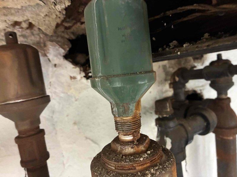 Performed routine heating maintenance on residential system. Discovered significant corrosion and mineral buildup on heat exchanger connections. Inspected control panel and thermostat functioning; all readings within normal parameters.