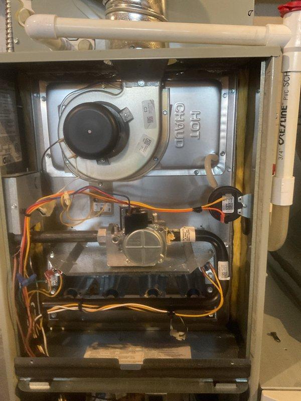 Performed routine monthly heating system maintenance on HOT GRAND furnace. Inspected blower motor, control board, gas valve, and electrical components - all found in proper working order with circuit board LED indicator functioning normally. PVC venting system verified clear with no obstructions.