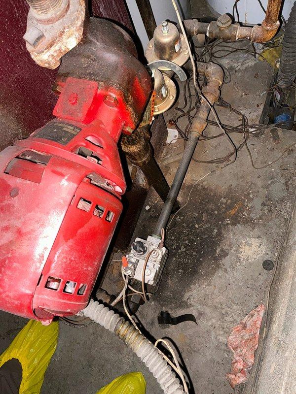 Performed evaluation of aging boiler system in basement mechanical area. Noted significant wear on primary circulation pump, extensive corrosion on copper piping connections, and recommended replacement options given age of existing equipment. System requires modernization to improve efficiency and reliability.