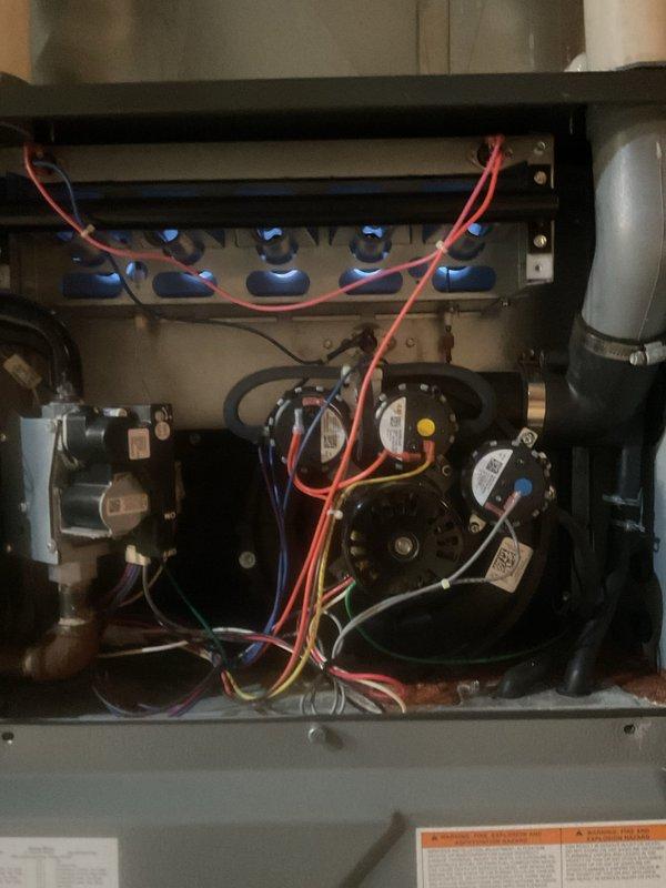 Performed maintenance on two heating furnace systems. Inspected exterior and interior components including electrical wiring, blower assemblies, and ventilation pipes. All systems functioning properly with no issues identified.