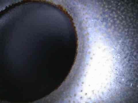 Responded to recurring heat distribution issue affecting half of customer's residence. Upon inspection, found significant corrosion around heat exchanger opening and evidence of condensation/particle buildup on interior surfaces. Corrected the heating imbalance by addressing these deteriorated components.