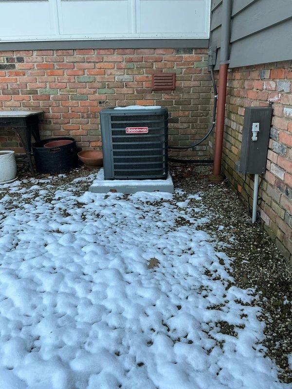 Assessed Goodman exterior condensing unit and interior furnace system for replacement options after temporary repair of failed ignitor. Documented current installation including concrete pad placement, electrical connections, and ductwork configuration to prepare comprehensive replacement estimate. Customer advised of both immediate fix and long-term replacement solutions for aging HVAC system.
