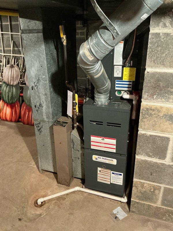 Assessed Goodman exterior condensing unit and interior furnace system for replacement options after temporary repair of failed ignitor. Documented current installation including concrete pad placement, electrical connections, and ductwork configuration to prepare comprehensive replacement estimate. Customer advised of both immediate fix and long-term replacement solutions for aging HVAC system.