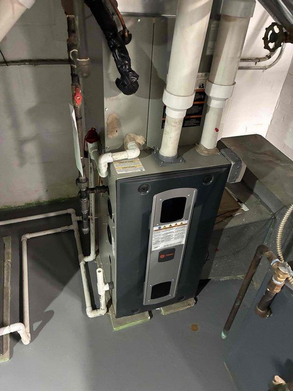 Performed scheduled monthly heating maintenance on two furnace systems. Conducted thorough inspection of the primary unit, checking all connections including gas line, PVC venting, and drainage components. Temperature differential measurements taken with UEI meter showed 56.0° reading, confirming proper system operation. Both units are functioning within normal parameters.