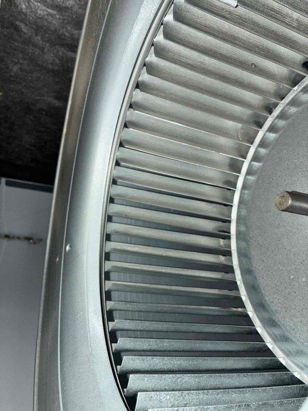 Performed routine heating maintenance service on unit. Inspected blower wheel assembly for proper operation, noting minor dust accumulation but overall good condition. Checked mechanical components and ductwork connections for integrity and functionality. System operational after service.