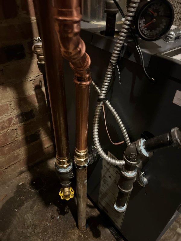 Successfully completed boiler installation with comprehensive copper pipe network and proper connections throughout the system. Installed all required brass fittings, valves, and pressure gauges to ensure optimal operation and system monitoring capabilities. All components were properly mounted and tested to confirm proper functionality before completion.