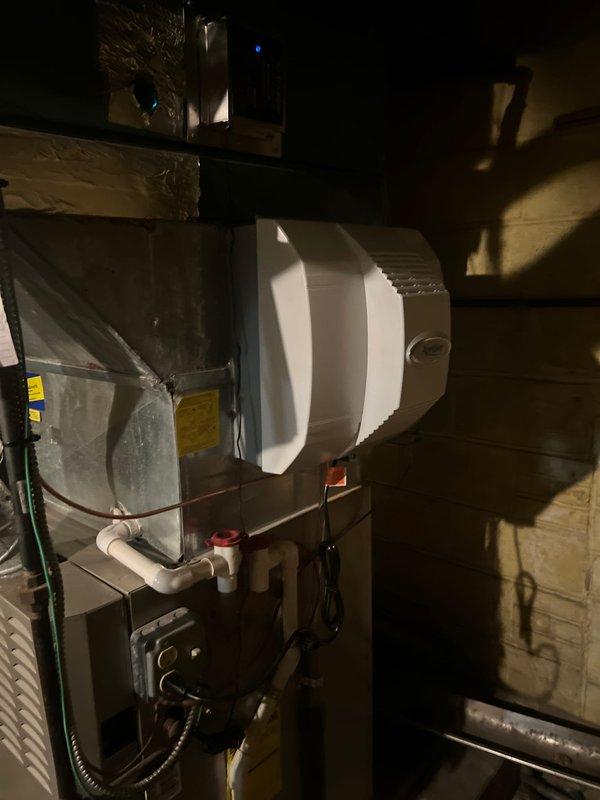 Returned to property to complete installation of a whole-home humidifier on existing HVAC system. Successfully mounted humidifier unit on furnace, connected necessary PVC water supply lines, and installed electrical components. Verified proper operation of humidifier after installation with all connections secure and system functioning as designed.