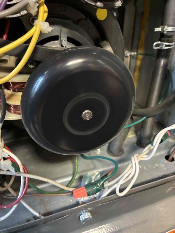 Performed routine heating maintenance on dual system setup. Inspected blower assembly components including motor, wheel, and electrical connections. Conducted diagnostic measurements with digital analyzer showing system operating within parameters (35/88 readings).